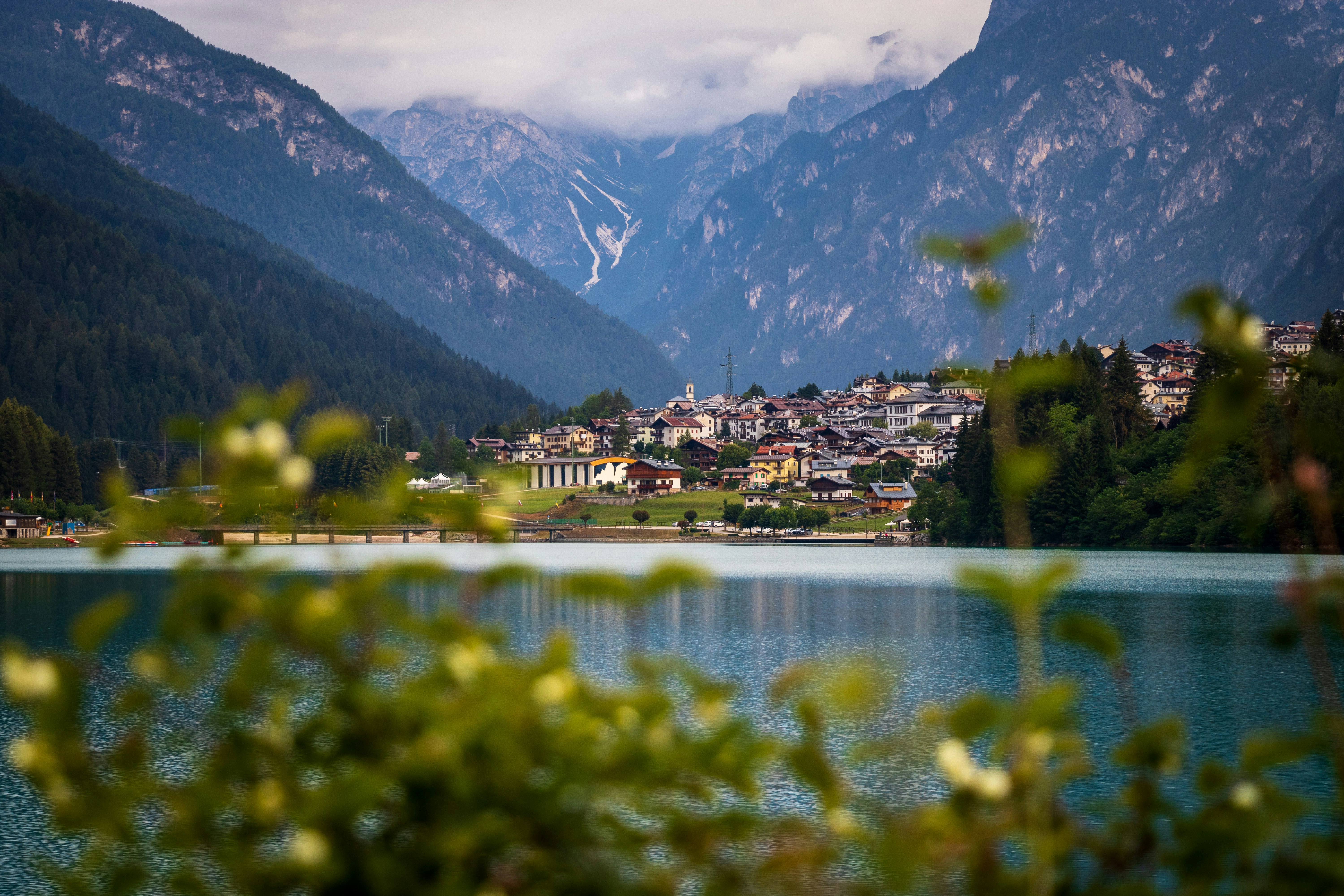 houses and calm body of water during daytime